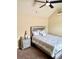 Cozy bedroom with a plush bed, neutral tones, and a classic bedside table and décor at 558 Hideaway Dr, Jonesboro, GA 30238