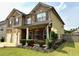 Attractive two-story home with manicured landscaping, a covered porch, and a two-car garage at 558 Hideaway Dr, Jonesboro, GA 30238