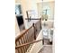 View of the foyer with wooden staircase and decorative vases at 558 Hideaway Dr, Jonesboro, GA 30238