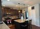 Well-lit kitchen featuring granite countertops, stainless steel appliances, and a stylish center island at 558 Hideaway Dr, Jonesboro, GA 30238