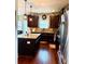 Dark cabinetry, stainless steel appliances, and a granite topped island highlight this well-designed kitchen at 558 Hideaway Dr, Jonesboro, GA 30238