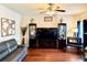 Cozy living room featuring hardwood floors, modern decor, and ample natural light at 558 Hideaway Dr, Jonesboro, GA 30238