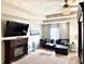 Comfortable main bedroom featuring a ceiling fan, fireplace, and cozy seating area at 558 Hideaway Dr, Jonesboro, GA 30238