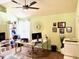 Inviting office space with natural light, featuring an ample work desk and decorative wall art at 558 Hideaway Dr, Jonesboro, GA 30238