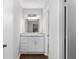 Bright bathroom features a modern vanity, granite countertop, and decorative light fixture at 603 Summit North Ne Dr # 603, Atlanta, GA 30324