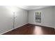 This bedroom offers dark hardwood floors and a window, offering great natural light at 603 Summit North Ne Dr # 603, Atlanta, GA 30324