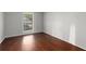 This light-filled bedroom has gleaming hardwood floors and a large window at 603 Summit North Ne Dr # 603, Atlanta, GA 30324