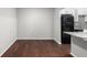 Dining area featuring hardwood floors and a view of the modern appliances in the kitchen at 603 Summit North Ne Dr # 603, Atlanta, GA 30324