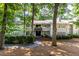 View of condo buildings with multiple balconies, surrounded by mature trees at 603 Summit North Ne Dr # 603, Atlanta, GA 30324