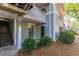 Exterior view of the condo building with stairs and landscaping at 603 Summit North Ne Dr # 603, Atlanta, GA 30324