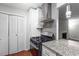 Kitchen with white cabinets, granite countertops, stainless appliances and easy access to living areas at 603 Summit North Ne Dr # 603, Atlanta, GA 30324
