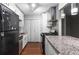 Modern kitchen with stainless steel appliances, white cabinets, and granite countertops at 603 Summit North Ne Dr # 603, Atlanta, GA 30324