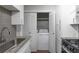 This is a convenient laundry space with tile backsplash and ample cabinet space at 603 Summit North Ne Dr # 603, Atlanta, GA 30324