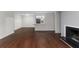 Open-concept living room with hardwood floors and a fireplace, adjacent to the kitchen at 603 Summit North Ne Dr # 603, Atlanta, GA 30324