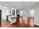 Open-concept living room with hardwood floors, adjacent to a modern kitchen with stainless steel appliances at 603 Summit North Ne Dr # 603, Atlanta, GA 30324