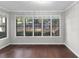 Bright living room featuring hardwood floors and a wall of windows overlooking the yard at 603 Summit North Ne Dr # 603, Atlanta, GA 30324