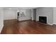 Spacious living room with hardwood floors, a fireplace, and an open floor plan at 603 Summit North Ne Dr # 603, Atlanta, GA 30324