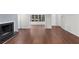 Bright living area with hardwood floors, fireplace, and view of front window at 603 Summit North Ne Dr # 603, Atlanta, GA 30324