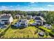 Aerial view of the backyard featuring a lush lawn, patio and an in-ground trampoline at 6168 Sweet Birch Ct, Acworth, GA 30101