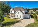 Expansive aerial view of a home, highlighting its landscaped yard, private driveway, and neighborhood setting at 6168 Sweet Birch Ct, Acworth, GA 30101