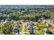 Expansive aerial view of a peaceful neighborhood with lush green trees and beautiful homes at 6168 Sweet Birch Ct, Acworth, GA 30101