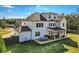 Aerial view of a spacious backyard with a covered patio and outdoor dining area at 6168 Sweet Birch Ct, Acworth, GA 30101