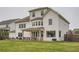 Expansive backyard features a covered patio with outdoor seating, a spacious lawn, and a well-maintained exterior at 6168 Sweet Birch Ct, Acworth, GA 30101