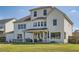 Backyard featuring a covered patio, dining area, and ample green space at 6168 Sweet Birch Ct, Acworth, GA 30101