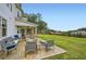 Backyard featuring a deck with outdoor seating, a lush lawn, and a playground with a wooded property line at 6168 Sweet Birch Ct, Acworth, GA 30101