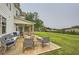 Inviting backyard patio with comfortable seating and a lush green lawn at 6168 Sweet Birch Ct, Acworth, GA 30101