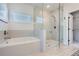 Bright bathroom featuring a soaking tub, glass-enclosed shower, and modern fixtures at 6168 Sweet Birch Ct, Acworth, GA 30101