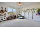 Playful bedroom decorated with whimsical tree decals, and a cozy corner at 6168 Sweet Birch Ct, Acworth, GA 30101