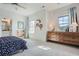 Bright bedroom with two windows, wood dresser, and colorful accents at 6168 Sweet Birch Ct, Acworth, GA 30101