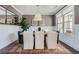 Modern dining room with white paneled walls, and a large window for natural light at 6168 Sweet Birch Ct, Acworth, GA 30101