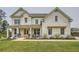 Charming white brick home with well-manicured lawn, covered front porch, and double doors at 6168 Sweet Birch Ct, Acworth, GA 30101