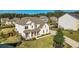 Aerial view of a white home showcasing its well-manicured lawn and landscaping at 6168 Sweet Birch Ct, Acworth, GA 30101