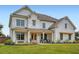 Elegant home with brick and siding exterior, showcasing a covered porch, and meticulously maintained lawn at 6168 Sweet Birch Ct, Acworth, GA 30101