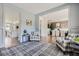 Welcoming hallway featuring stylish decor, elegant wainscoting, and seamless flow into the kitchen and dining areas at 6168 Sweet Birch Ct, Acworth, GA 30101