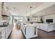 Modern kitchen with a large island, sleek countertops, and open layout that seamlessly connects to the living area at 6168 Sweet Birch Ct, Acworth, GA 30101
