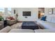 Comfortable living room with a shiplap wall, gray sofas, and plush ottoman at 6168 Sweet Birch Ct, Acworth, GA 30101