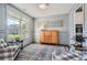 Stylish living space with light blue walls, a large window, and elegant furnishings at 6168 Sweet Birch Ct, Acworth, GA 30101