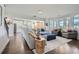 Elegant living room with hardwood floors, comfortable seating, and natural light, flowing into the kitchen area at 6168 Sweet Birch Ct, Acworth, GA 30101