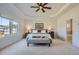Bright main bedroom with a ceiling fan and windows bringing in natural light at 6168 Sweet Birch Ct, Acworth, GA 30101