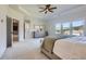 Tranquil primary bedroom with a trey ceiling, large windows, and walk through to bathroom at 6168 Sweet Birch Ct, Acworth, GA 30101