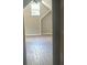 Attic bedroom with natural light and wood floors, creating a cozy retreat at 1119 Plantation Se Dr, Conyers, GA 30094