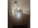 Spacious attic with wood-like flooring, ceilings fans, and windows for natural light at 1119 Plantation Se Dr, Conyers, GA 30094