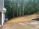 View of the backyard featuring freshly laid straw and landscaping at 1119 Plantation Se Dr, Conyers, GA 30094