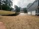 New construction featuring a retaining wall and an extended driveway at 1119 Plantation Se Dr, Conyers, GA 30094