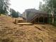Backyard featuring new deck and retaining wall on a sloping lot at 1119 Plantation Se Dr, Conyers, GA 30094