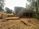 Backyard with a new deck, stairs, and professionally landscaped hill at 1119 Plantation Se Dr, Conyers, GA 30094